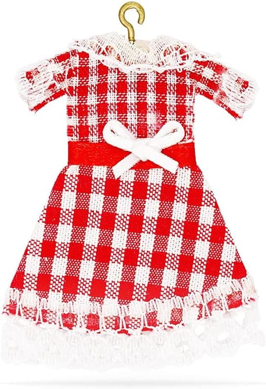 A miniature dress on a hanger for holiday elf setups.