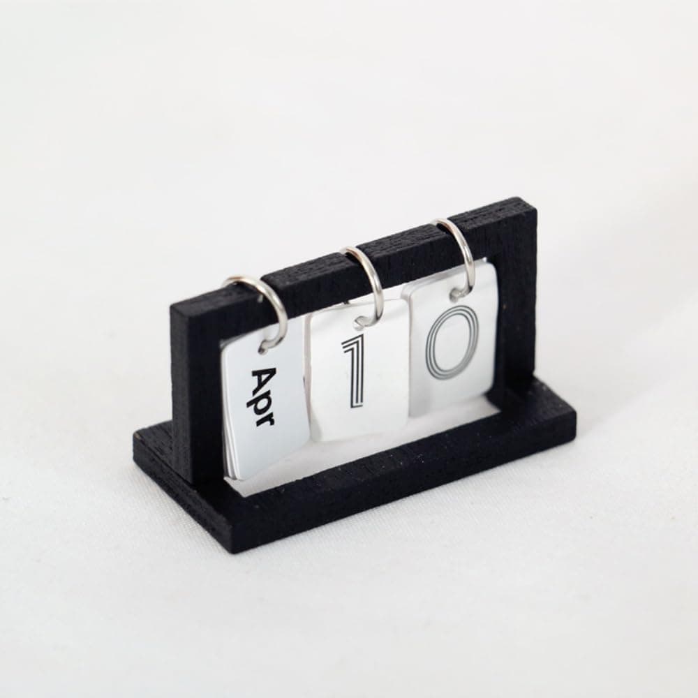 A miniature calendar for holiday elf setups.