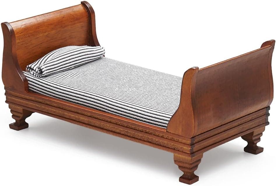 A miniature bed for holiday elf setups.
