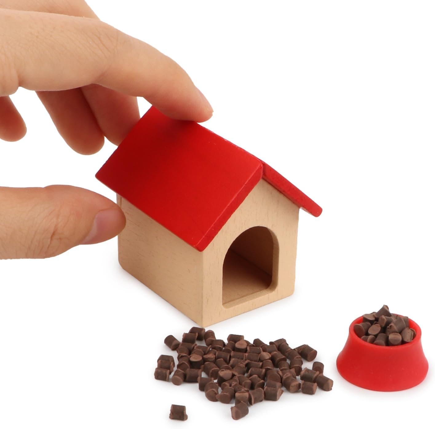 A miniature dog house and bowl for holiday elf setups.